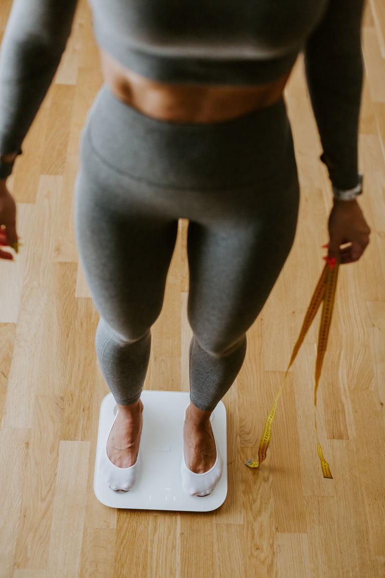 Woman Measuring Body Weight